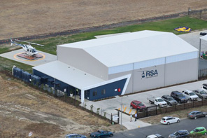 Birdseye view of large industrial shed and aircraft hangar